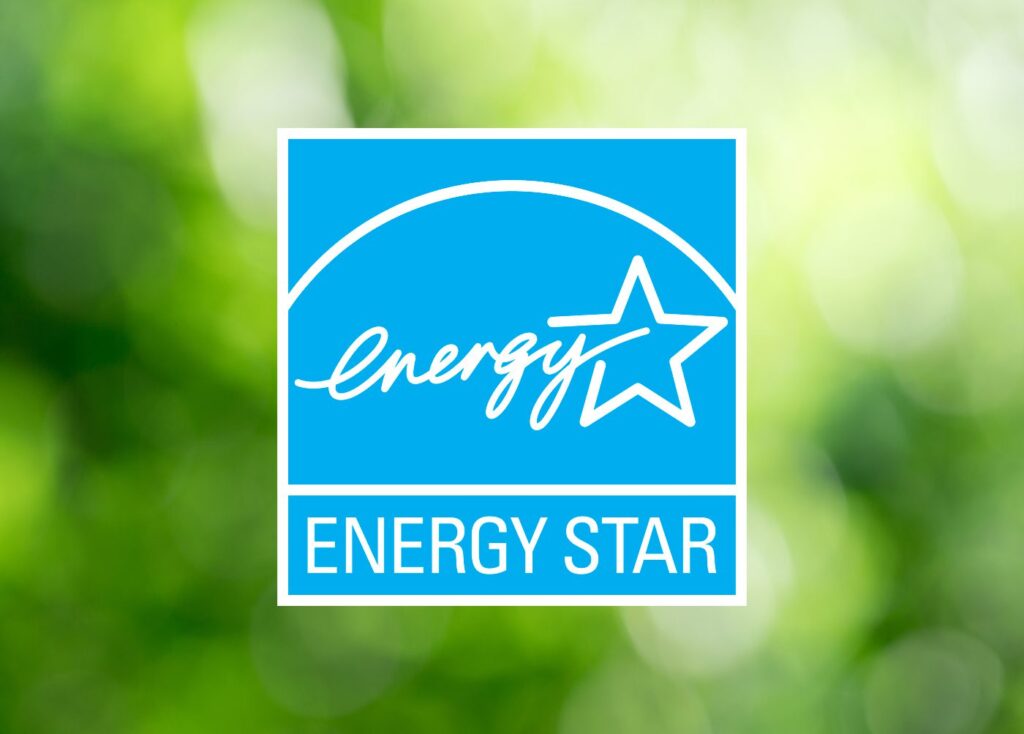 ENERGY STAR certified logo on a blurred green background, indicating energy-efficient windows.