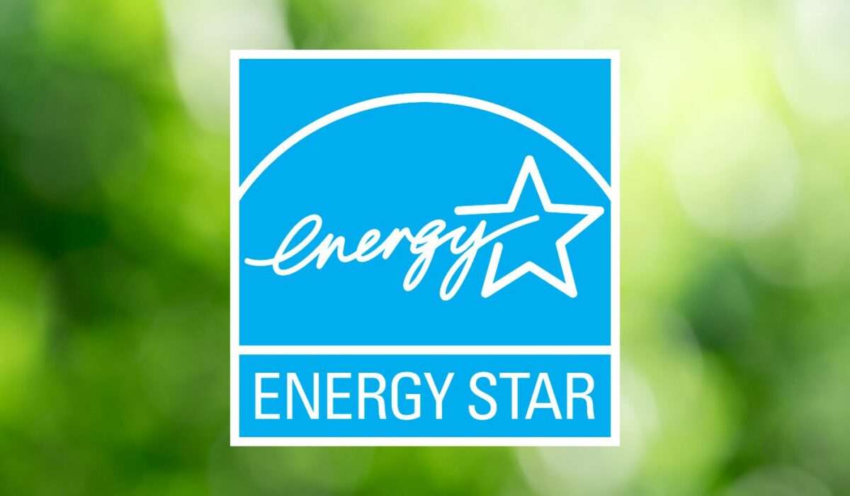 ENERGY STAR certified logo on a blurred green background, indicating energy-efficient windows.