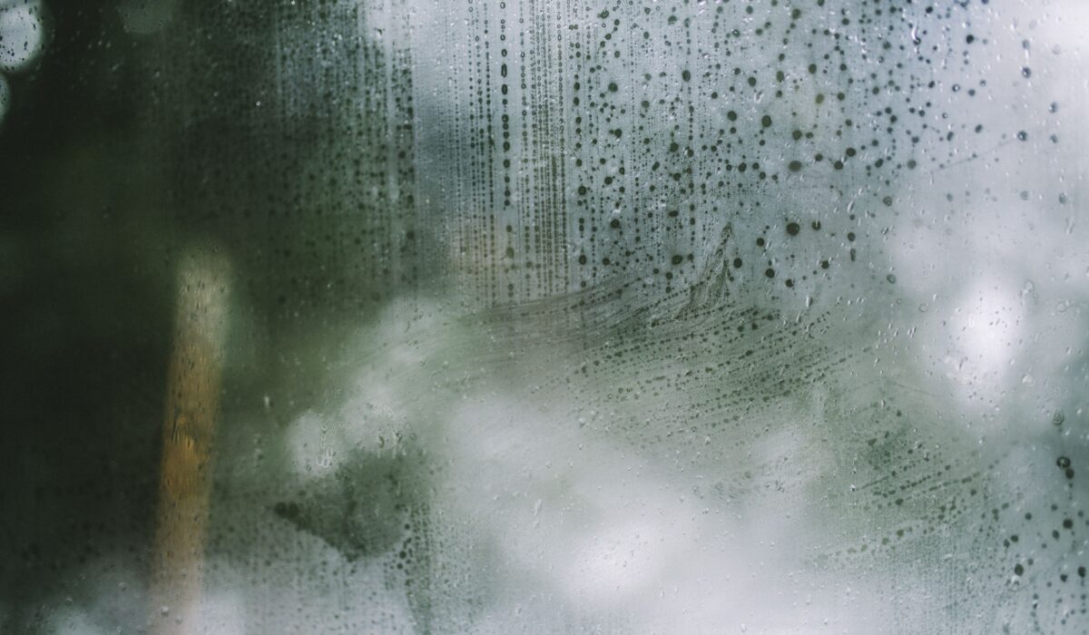 Up close image of a fogged window caused by trapped condensation.